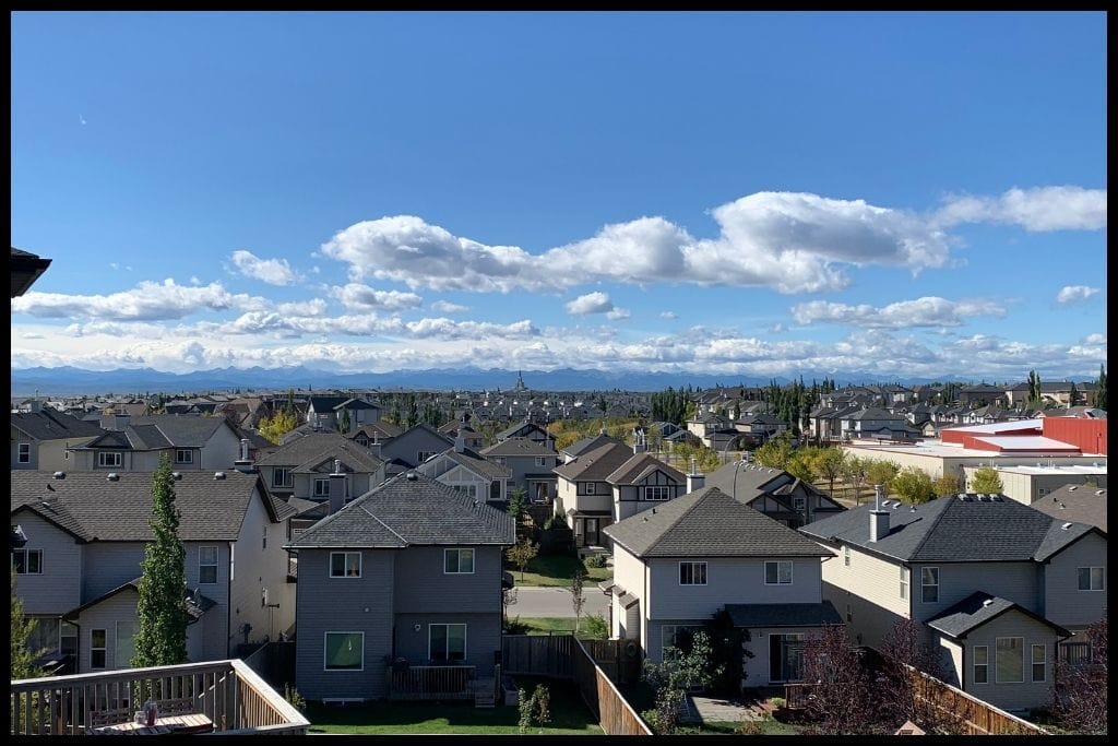 An image showing the neighbourhood of Royal Oak in Calgary with mountains in the distance.