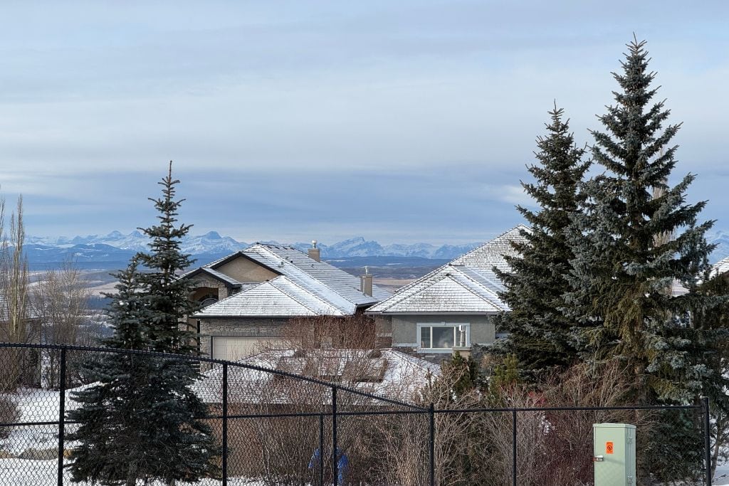 A residential neighbourhood in Cochrane, Alberta with mountain views.