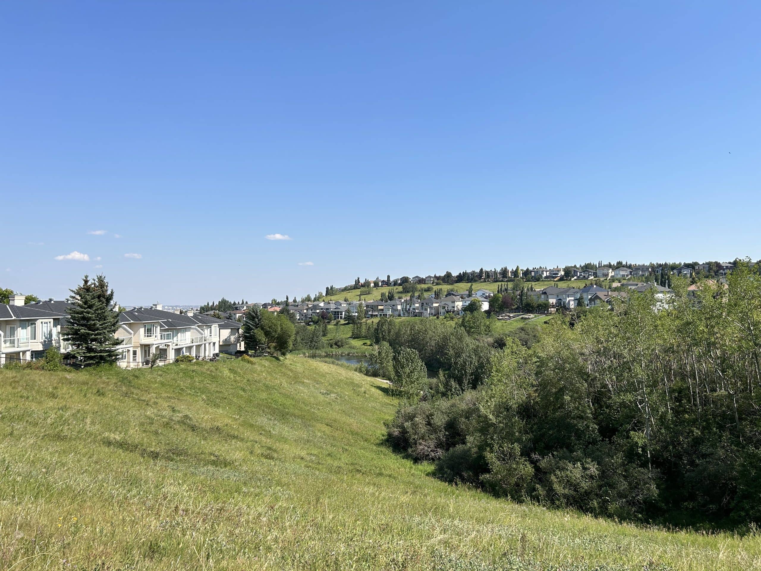 Beautiful green space and valley image of Edgemont Calgary.