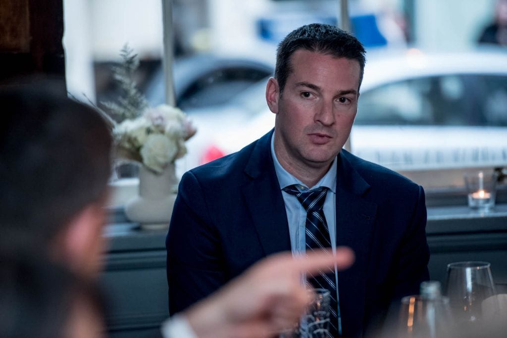 Ryan Gillard is a professional real estate agent meeting and discussing selling a home in Calgary.