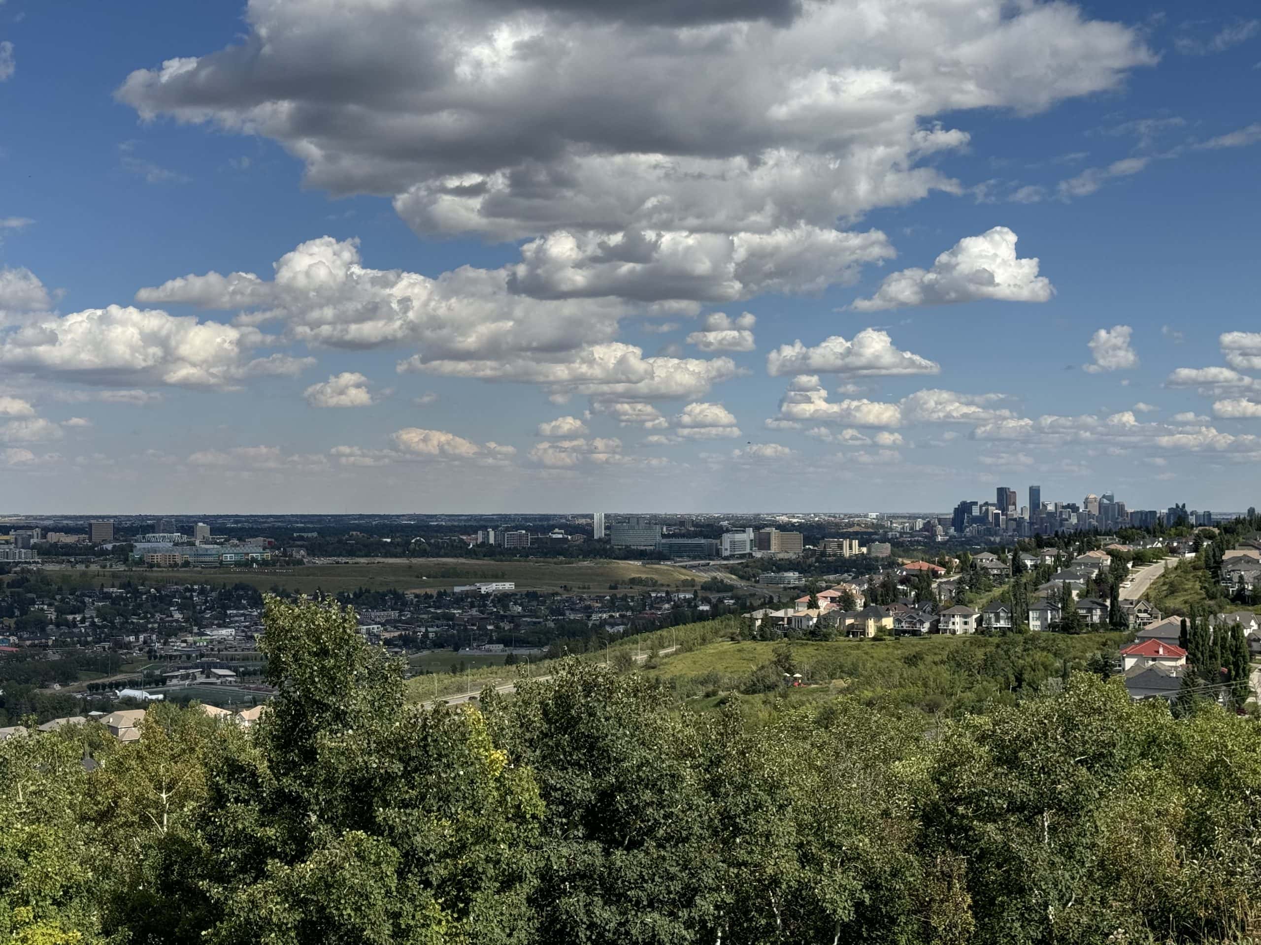 Family-friendly homes in Cougar Ridge with pathways, green spaces, and views of Canada Olympic Park and Downtown