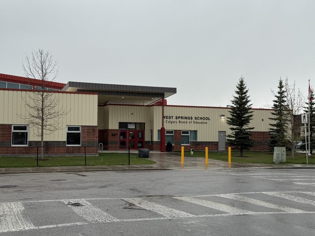 An image of the front entrance of West Springs School in Calgary.