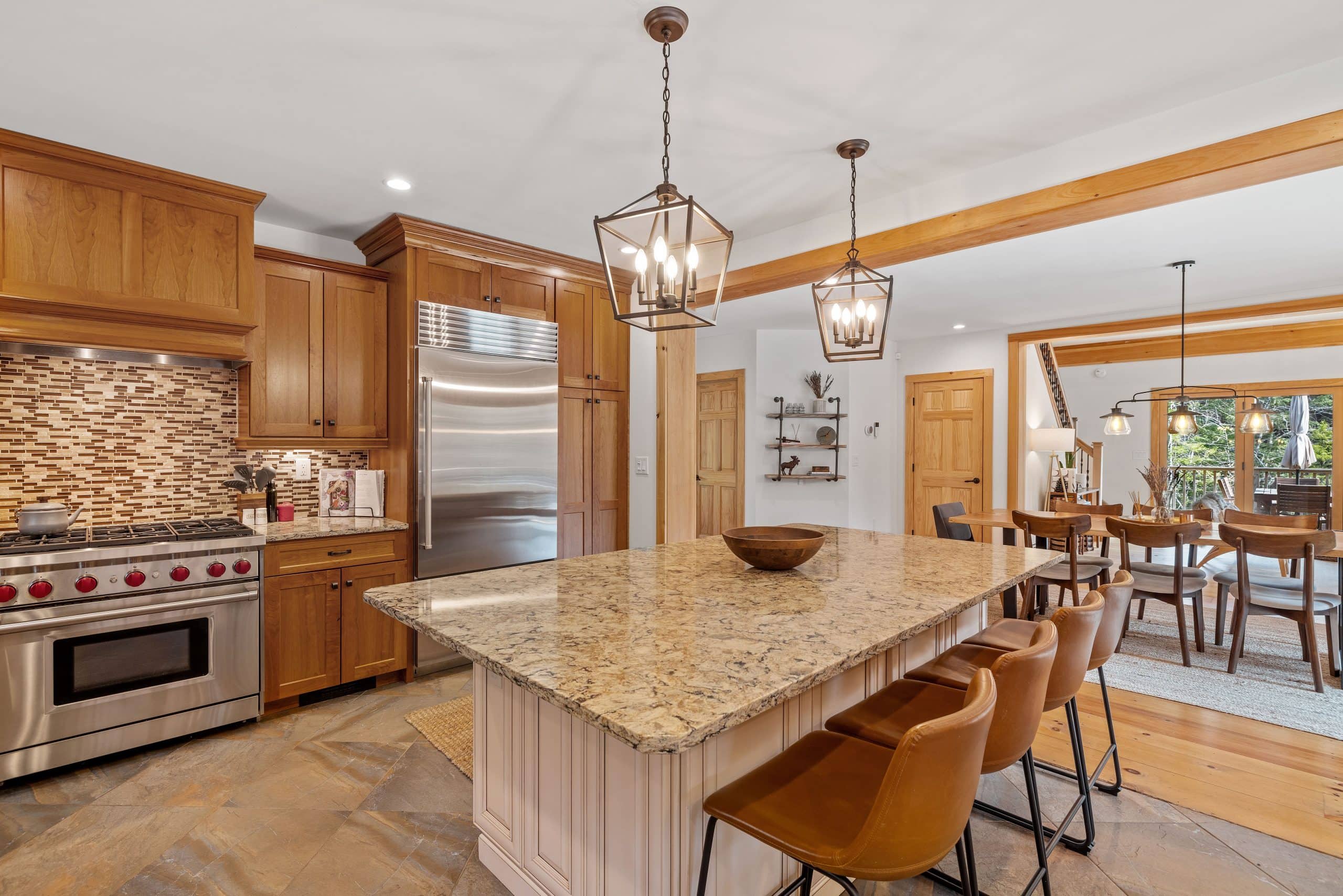 Beautifully lit modern kitchen in a Calgary home—high-quality photography helps attract buyers in a slow housing market.