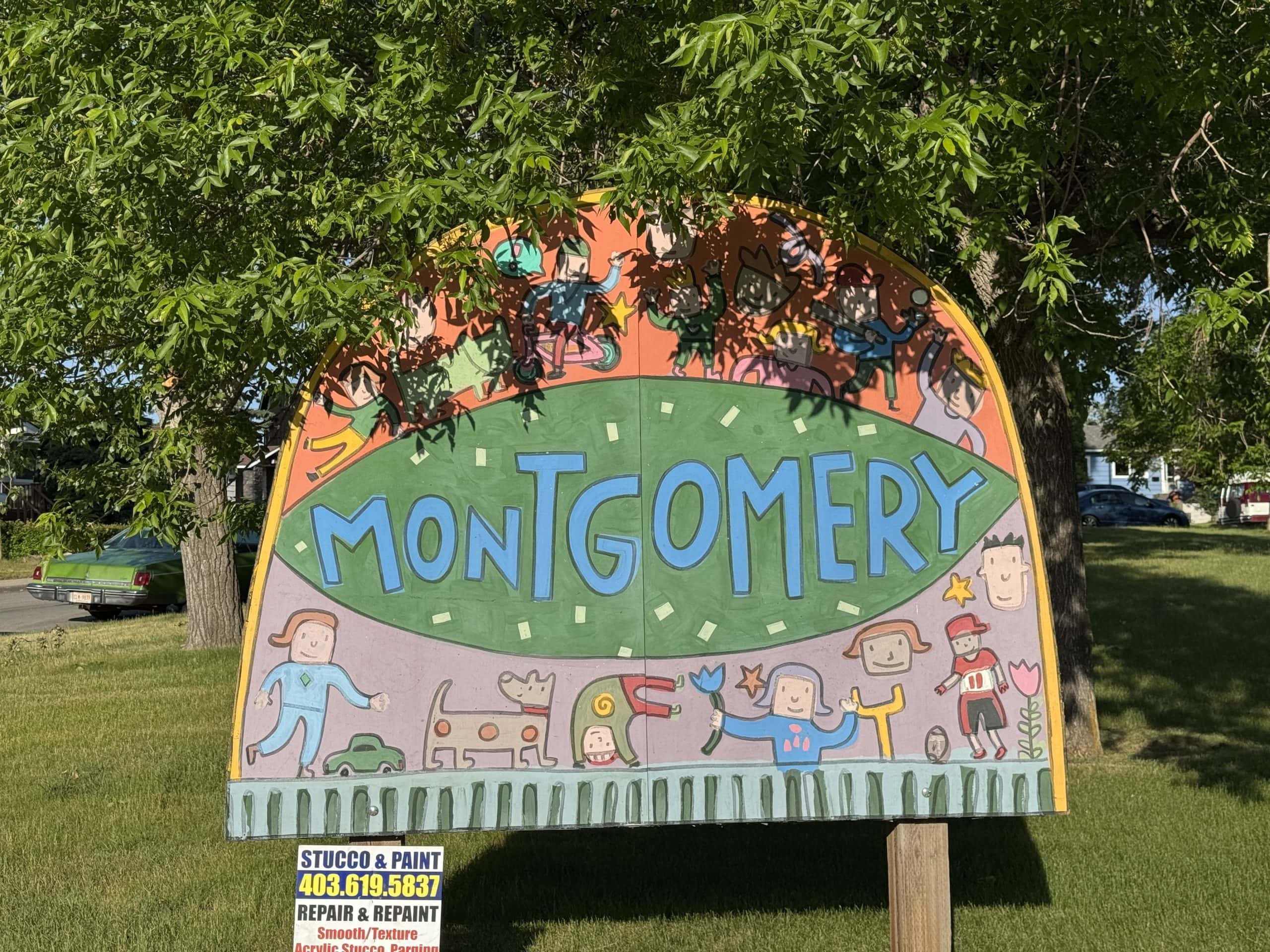 Welcome sign for Montgomery Calgary featuring playful community artwork in a park setting.
