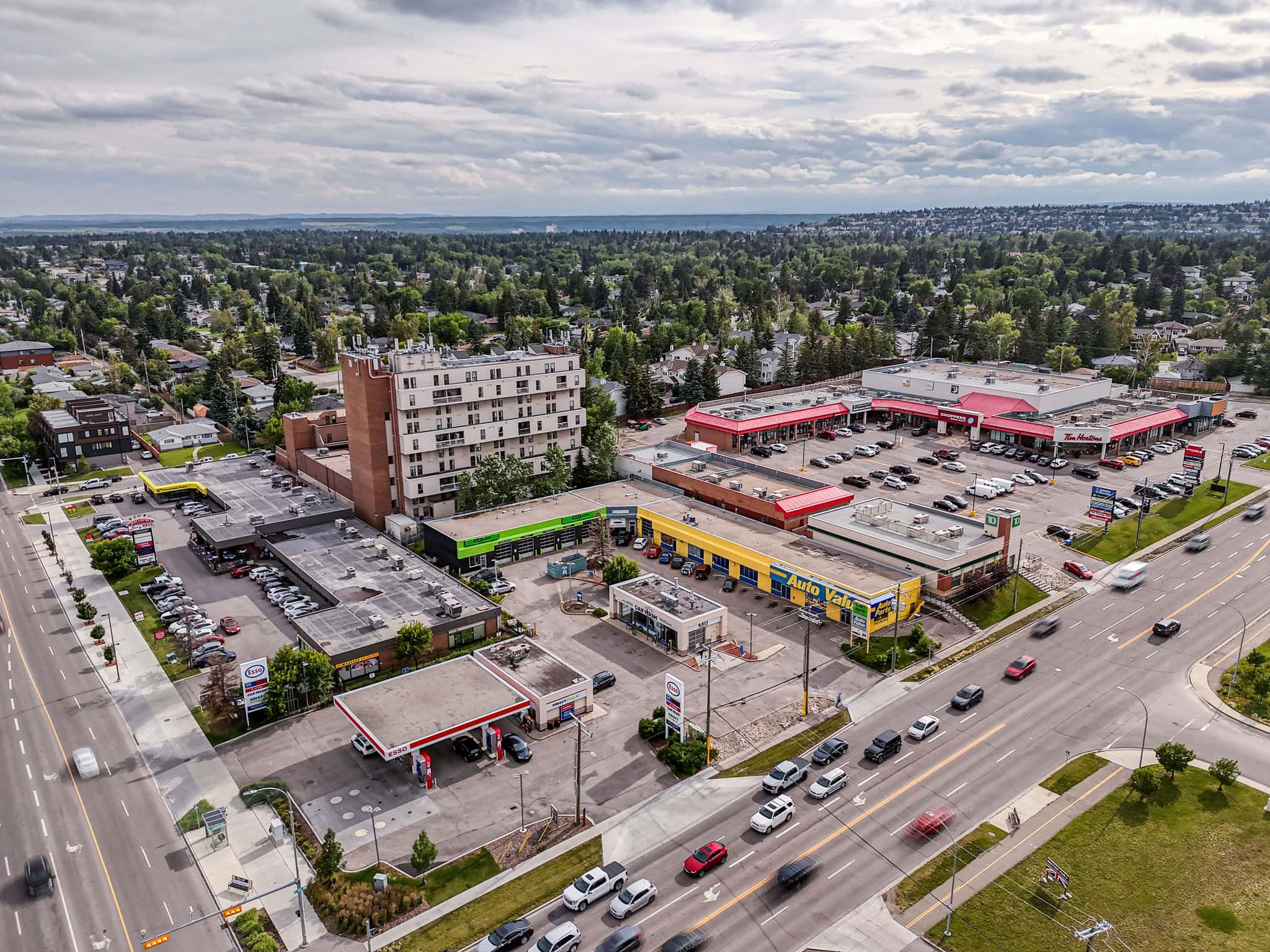 Aerial view of Killarney Calgary showcasing its commercial area with shops, services, and easy access to major roads, highlighting the neighbourhood’s convenience.
