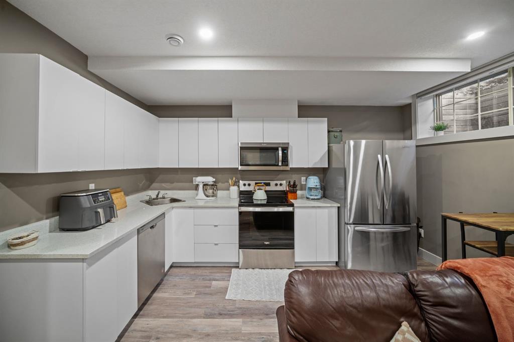 Legal basement suite in Calgary with modern kitchen, separate living space, and functional layout