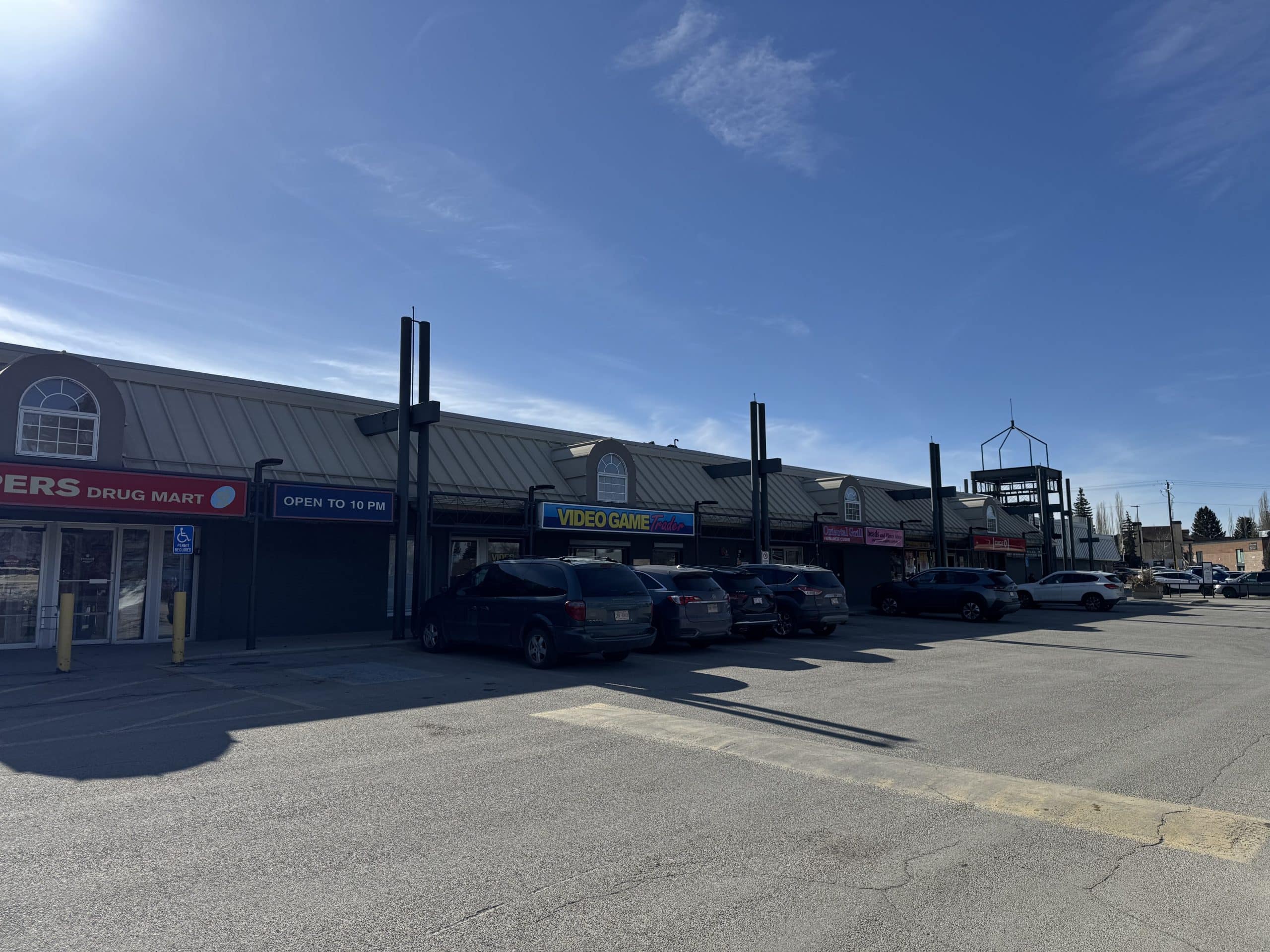 Lake Bonavista Calgary shopping plaza with local stores, convenient amenities, and parking in a central community hub