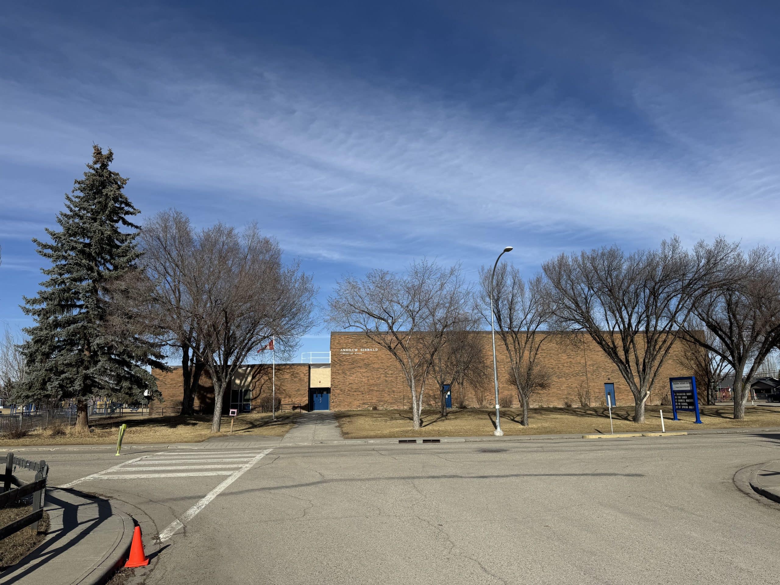 Andrew Sibbald School in Lake Bonavista Calgary with a large campus, mature trees, and a quiet residential setting