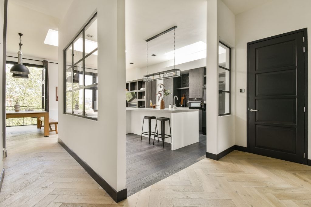 Modern Calgary home interior with partial open concept layout, glass walls, and contemporary kitchen design