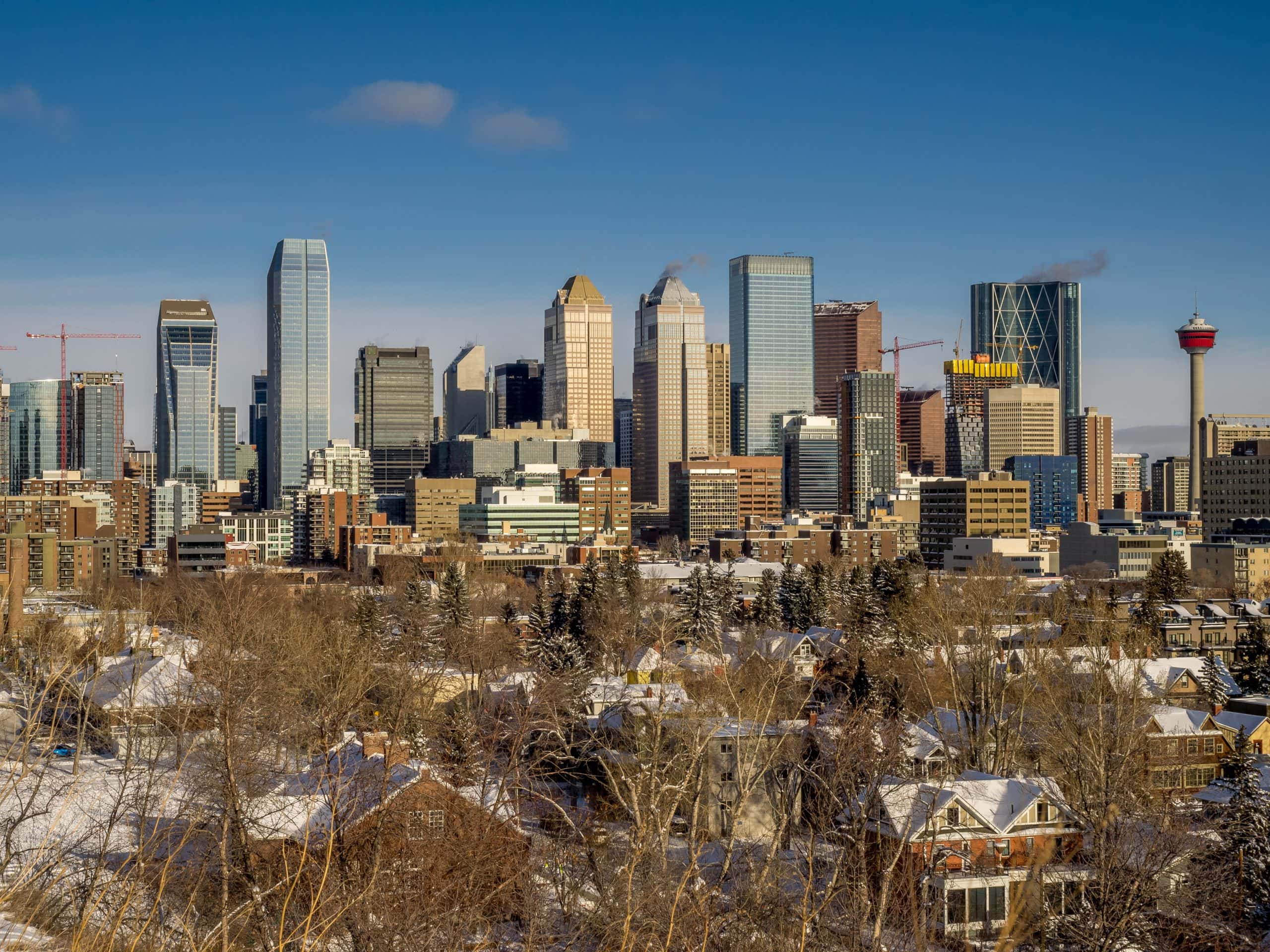 Calgary skyline during winter with downtown high rises and residential neighbourhood in foreground, representing the Calgary housing market update