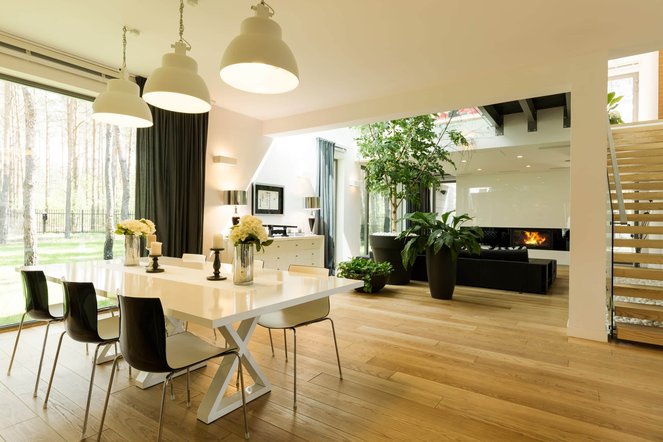 Modern new construction home interior in Calgary with open concept layout and upgraded finishes highlighting the difference between show homes and base models