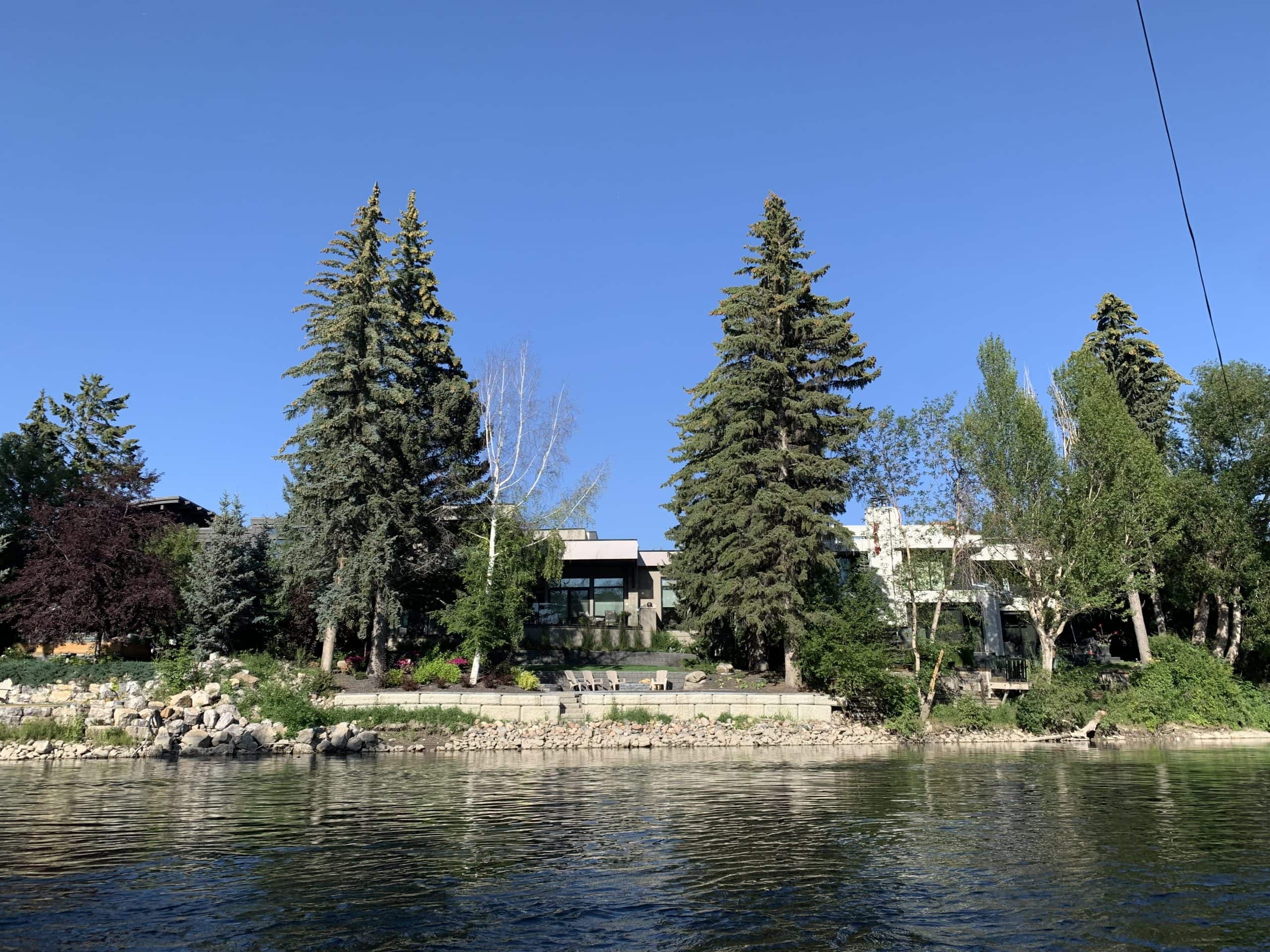 Luxury riverfront homes along the Elbow River in Calgary, featuring private waterfront access, mature landscaping, and prestigious inner city living.