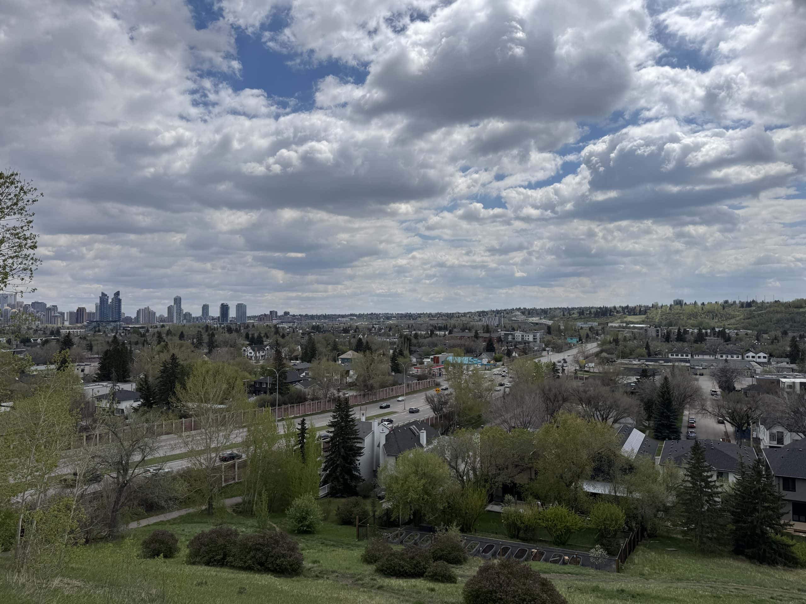 Calgary skyline and suburban commute route highlighting how long drive times and location choices can impact daily life after buying a home.