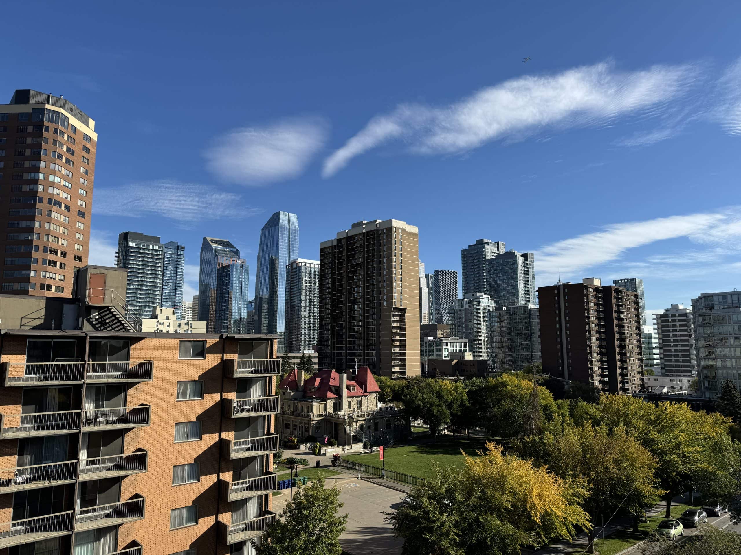 Calgary condo towers and apartment buildings near downtown as rising inventory and changing market conditions impact the local real estate market.