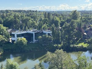 Luxury home overlooking the Elbow River in one of Calgary’s most prestigious neighbourhoods, featuring mature trees, privacy, and scenic valley views.