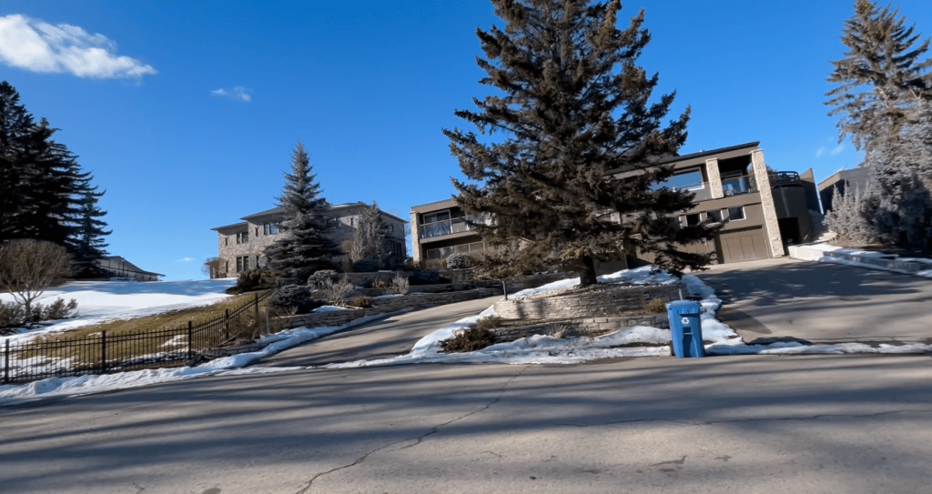 Luxury estate homes near Calgary’s Glenmore Reservoir, featuring oversized lots, mature landscaping, and the quiet prestige found in communities like Eagle Ridge, Pump Hill, and Bayview.