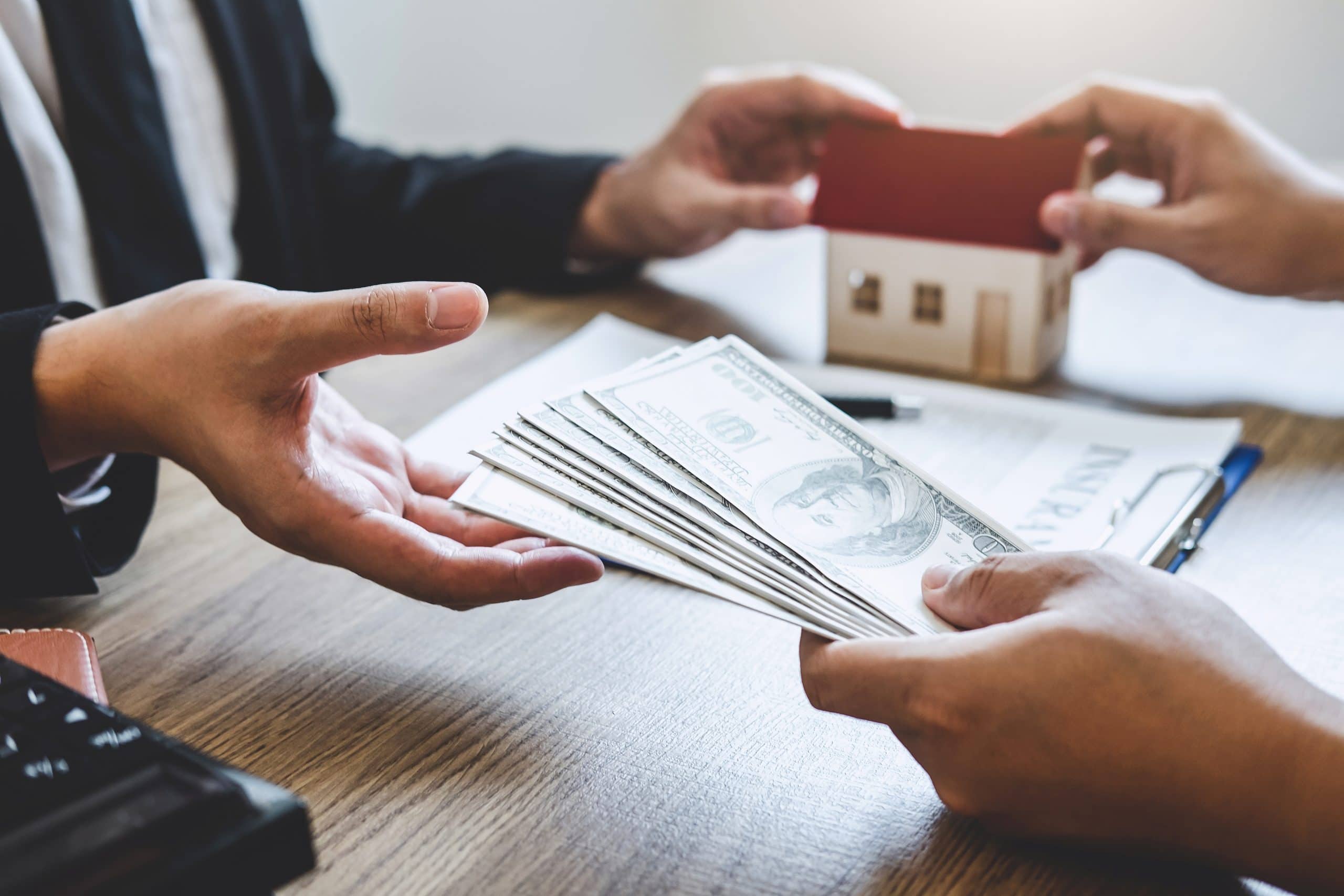 Cash down payment and mortgage financing discussion during a home purchase approval process in Calgary.