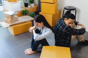 Calgary home buyer experiencing stress and regret after purchasing a house, representing common mistakes, financial pressure, and home buyer remorse in Calgary real estate.