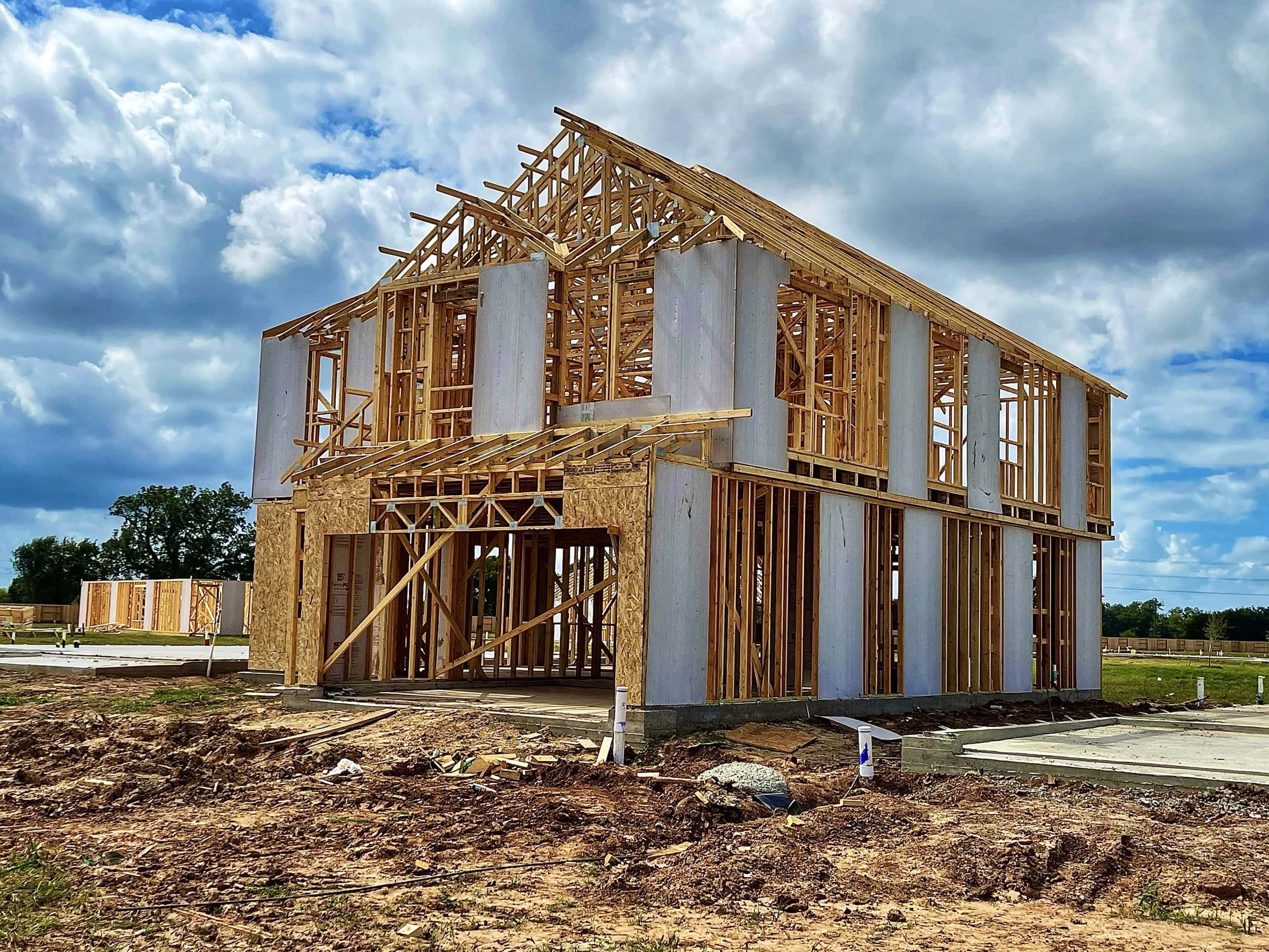 New home under construction in Calgary where buyers may need to budget for GST and applicable new home rebates before closing.