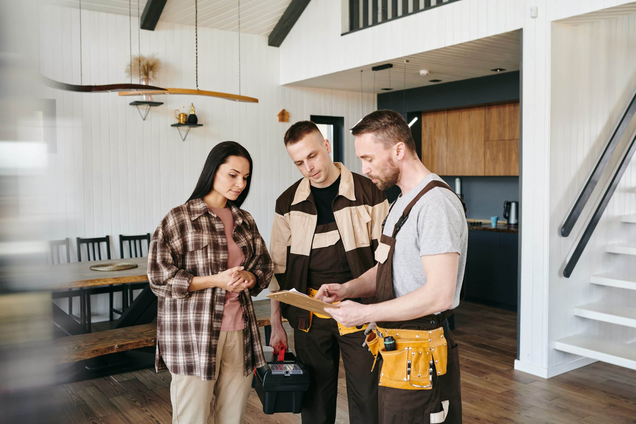 Professional home inspector reviewing findings with a Calgary home buyer during a pre purchase home inspection.