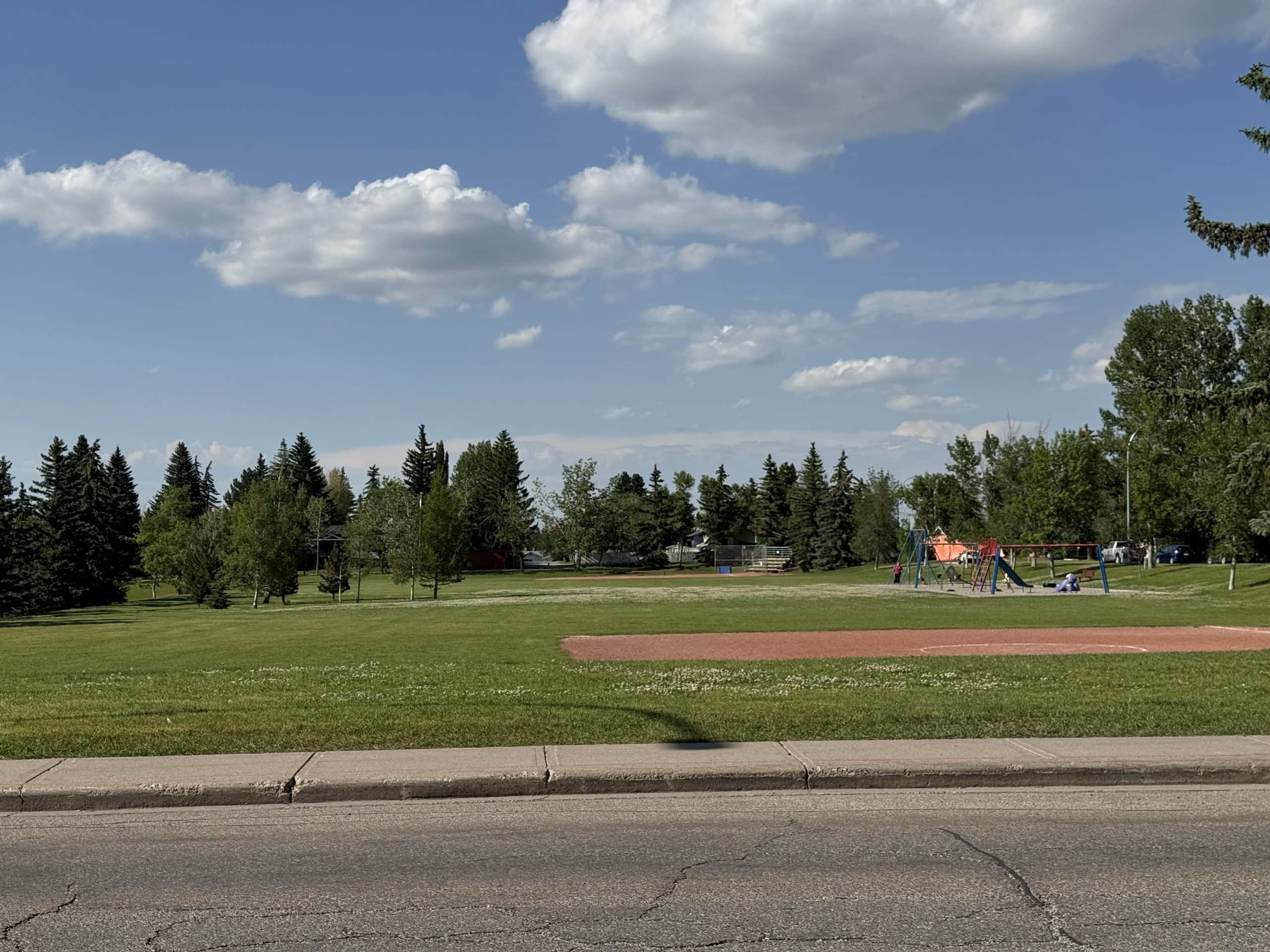 Community park and playground in Glamorgan, Calgary, featuring open green space and recreational amenities.