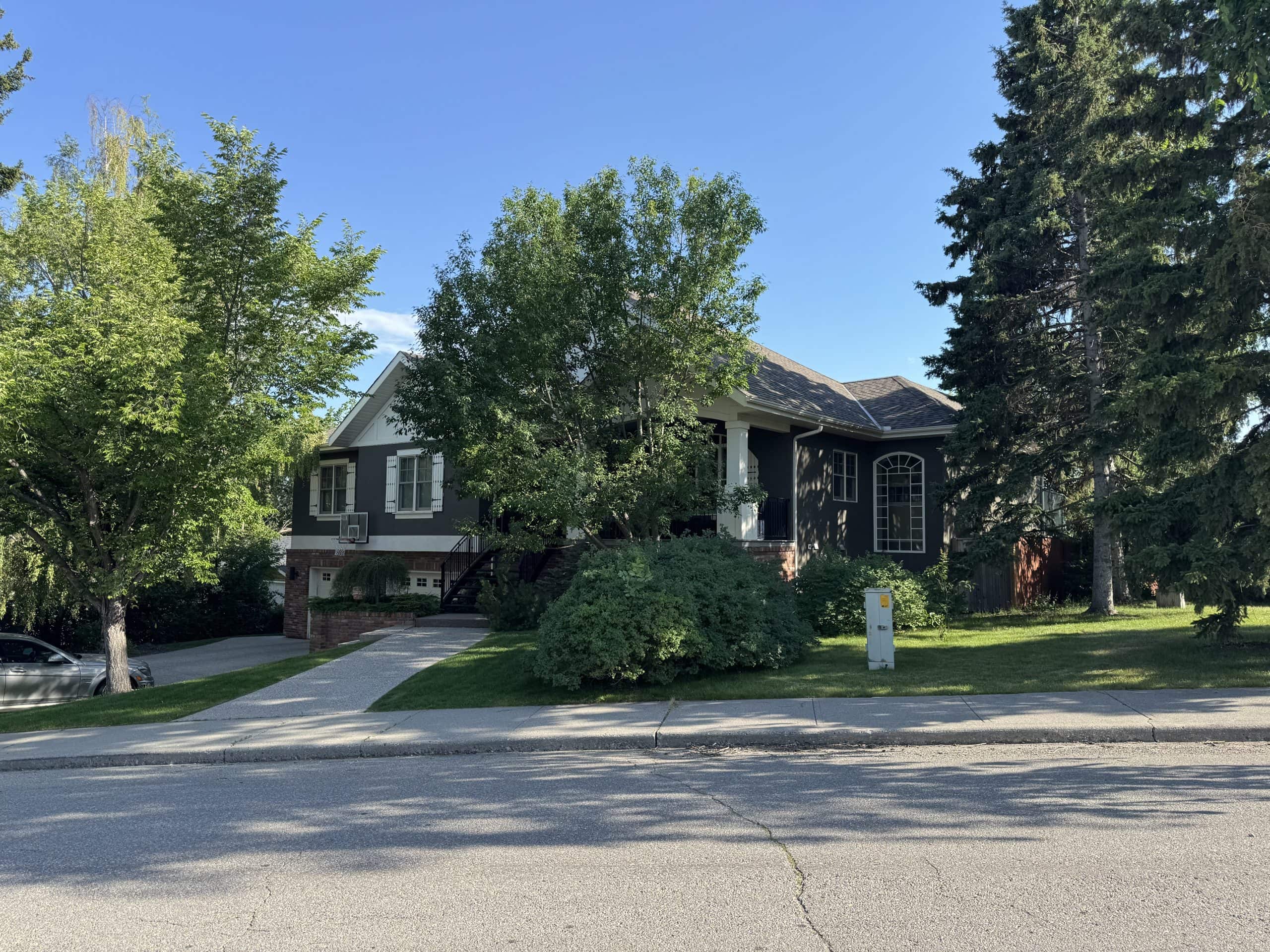 Large custom home on a spacious lot in Glendale, Calgary, highlighting the neighbourhood's premium detached homes, mature landscaping, and established west Calgary character.