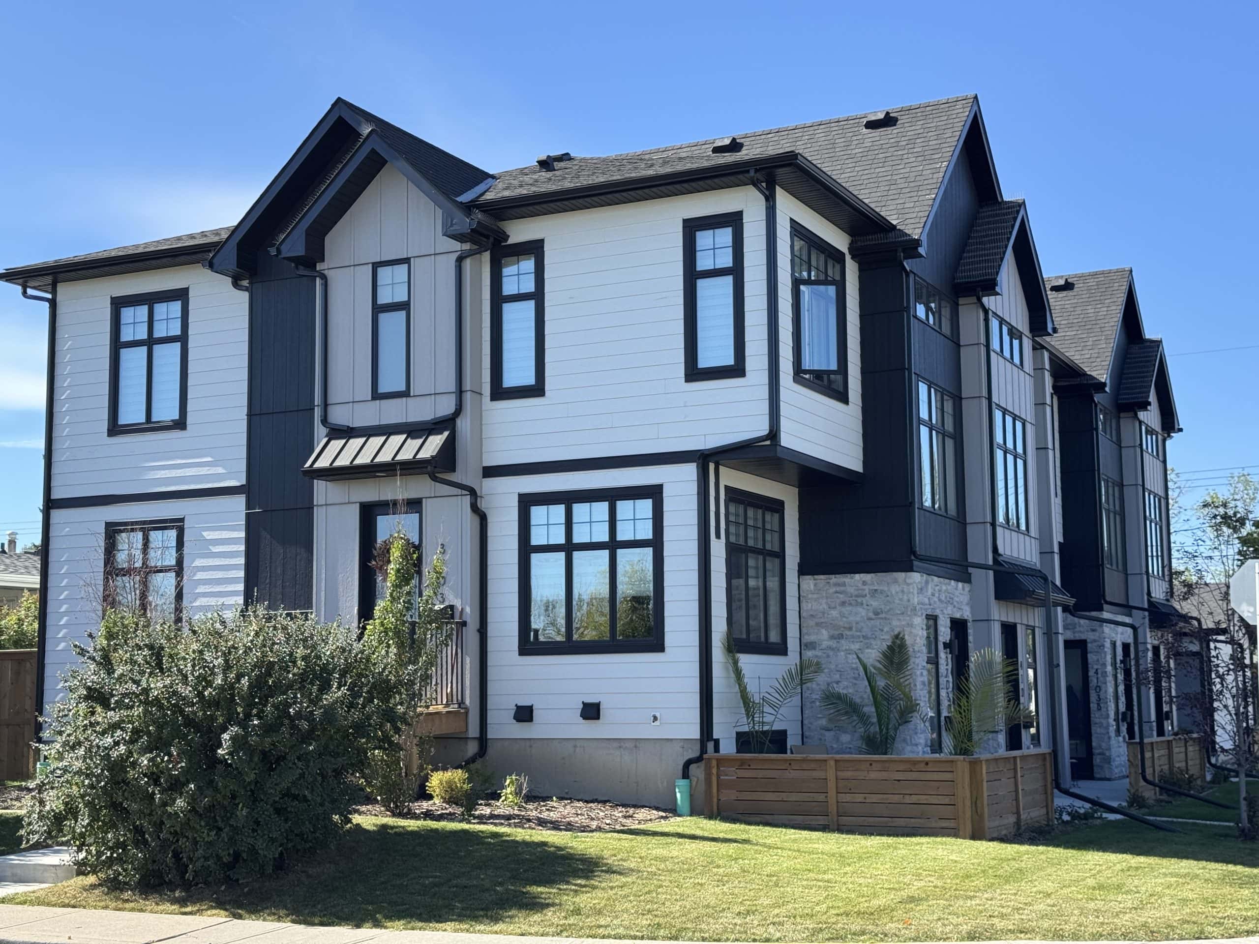 Modern infill homes in Glenbrook, Calgary, showcasing the neighbourhood's ongoing redevelopment alongside established streets, mature trees, and newer family friendly housing options.
