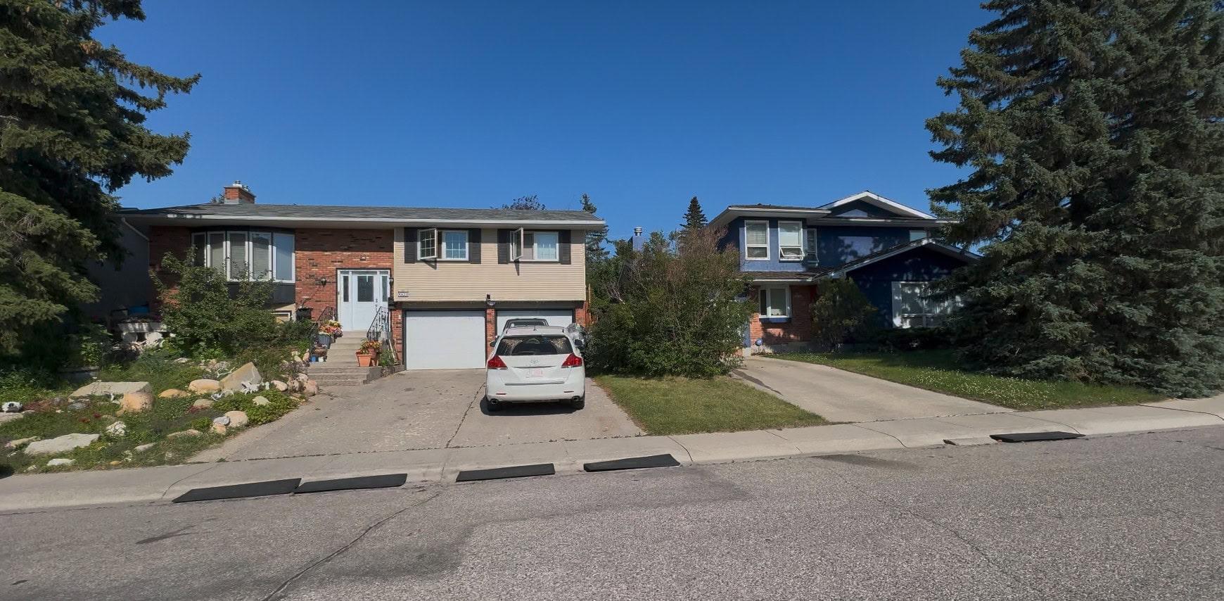 Detached homes in Glamorgan, Calgary, showcasing the neighbourhood's mature trees and established residential streets.
