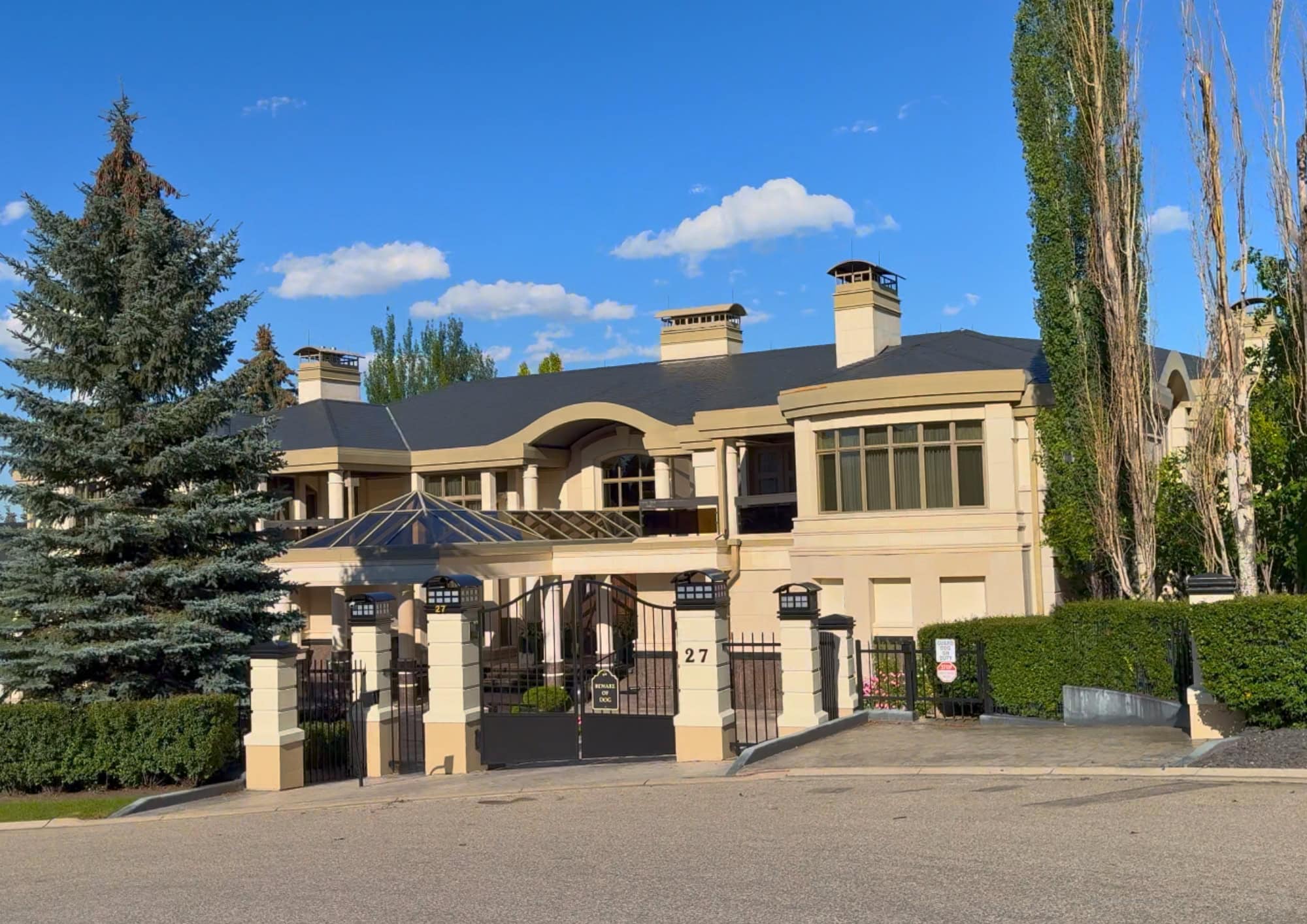 Luxury estate home in Pump Hill, one of Calgary's most prestigious southwest neighbourhoods, known for its large lots, custom homes, mature trees, and exclusive residential setting.