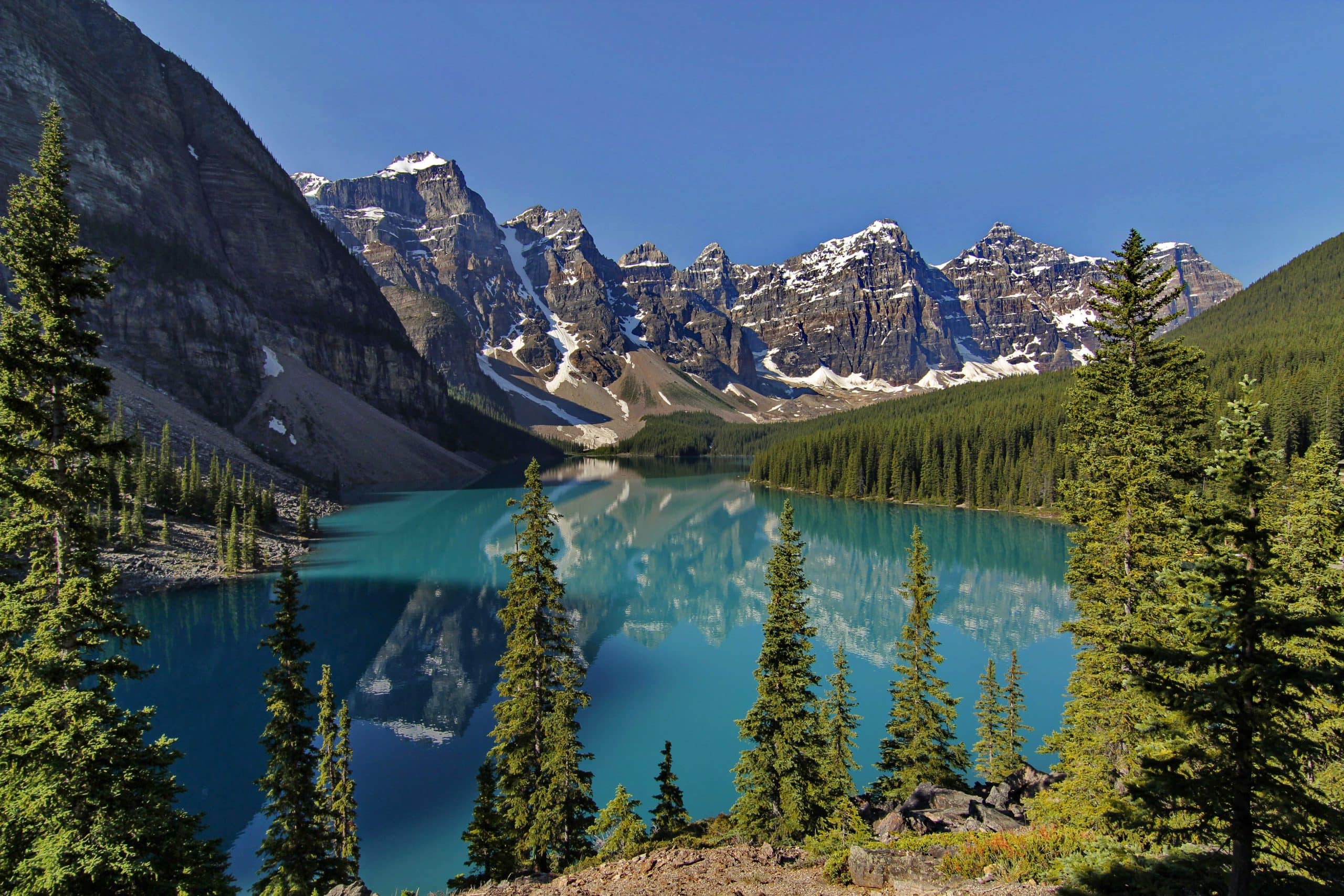 Moraine Lake with turquoise water reflecting the Valley of the Ten Peaks in Banff National Park, Alberta.