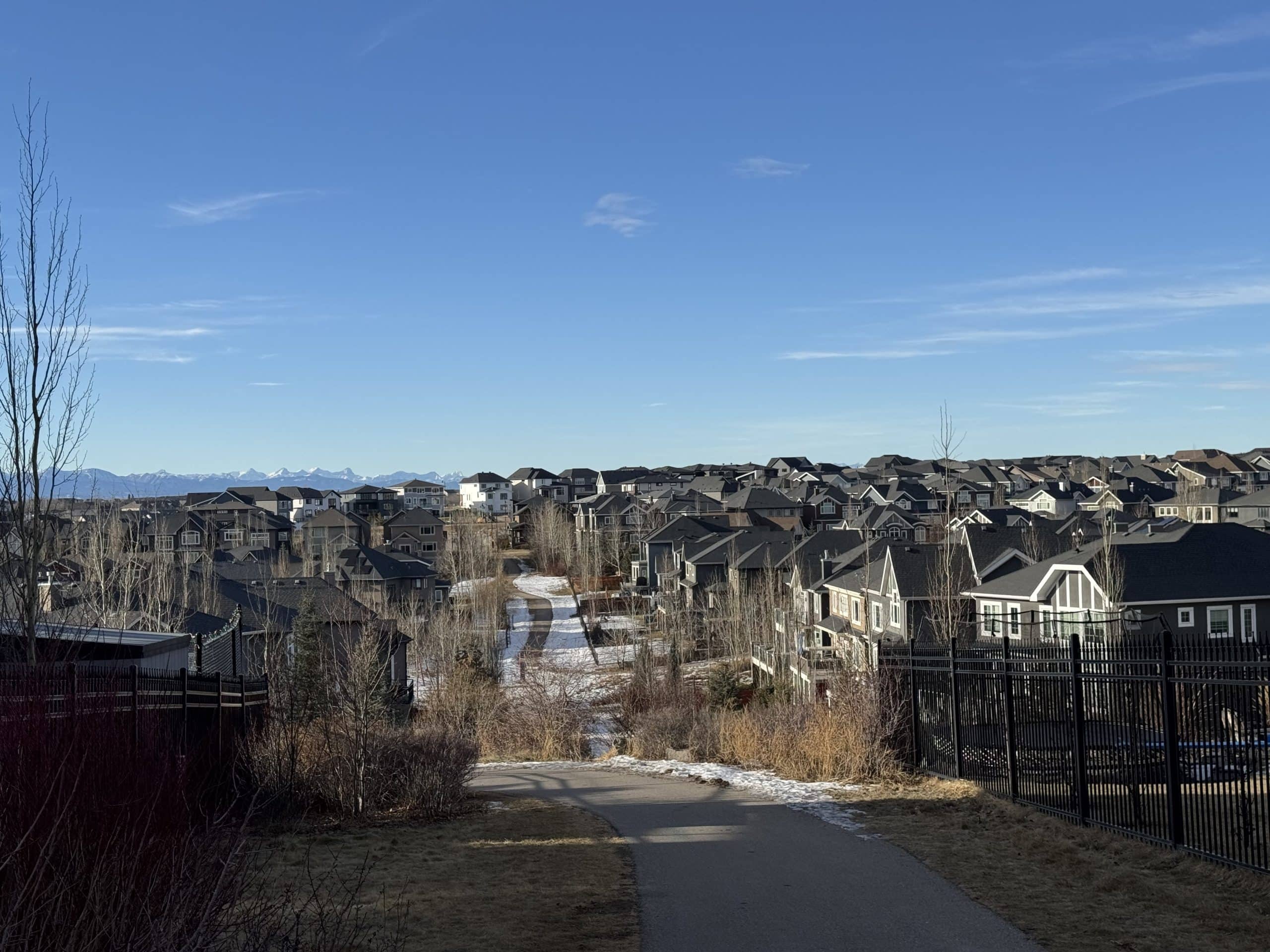 Aspen Woods homes with Rocky Mountain views, walking paths and green space in west Calgary, Alberta.