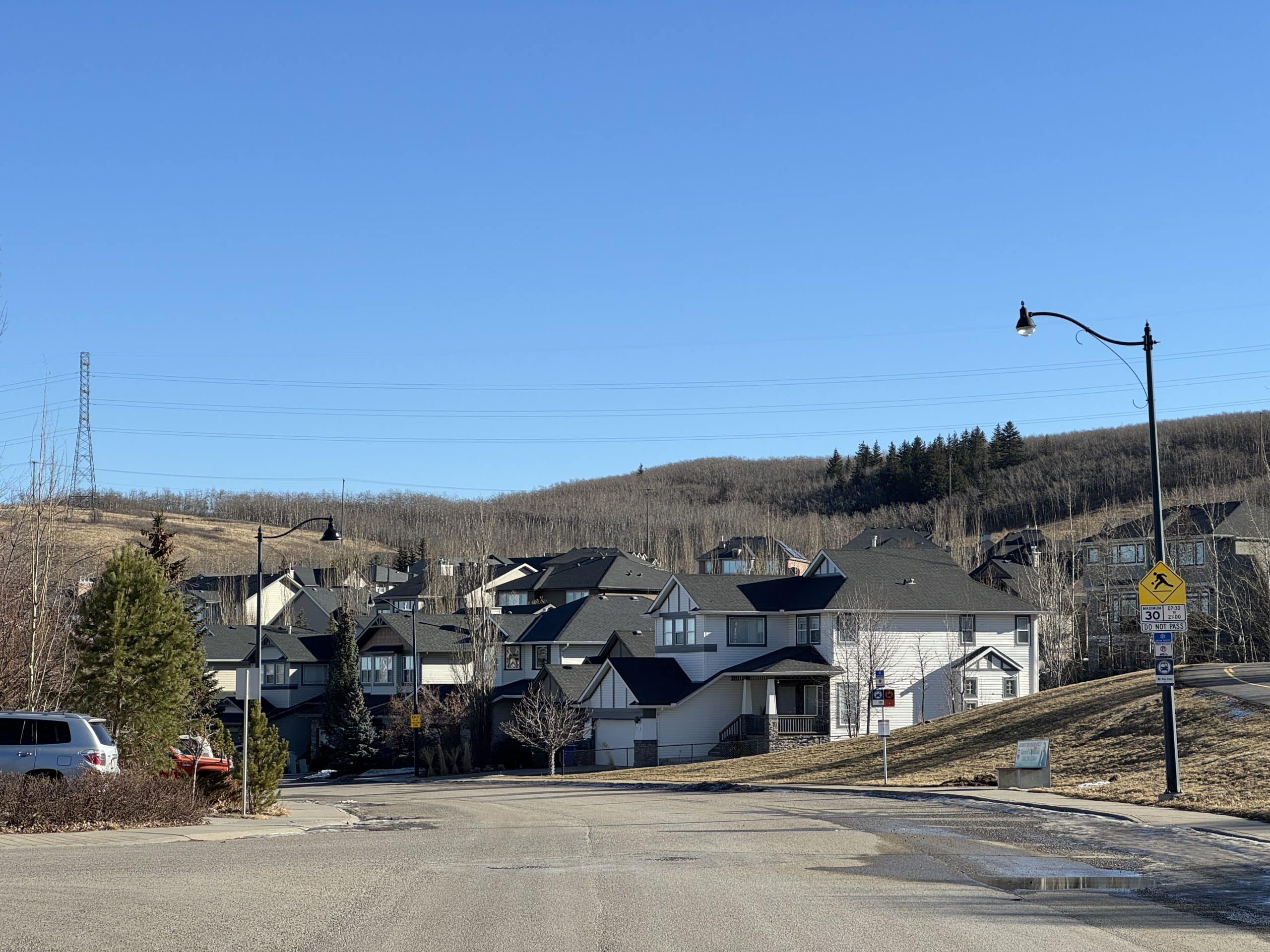 Crestmont homes set against the scenic hills and natural landscape of west Calgary, Alberta.