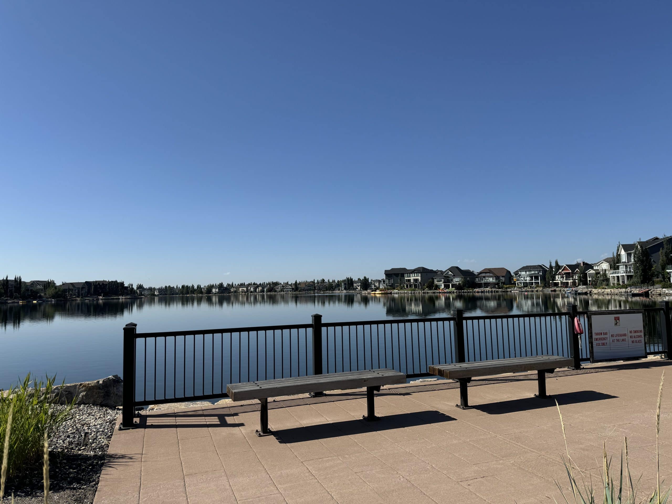 Auburn Bay Lake in southeast Calgary, surrounded by lakefront homes and community pathways.