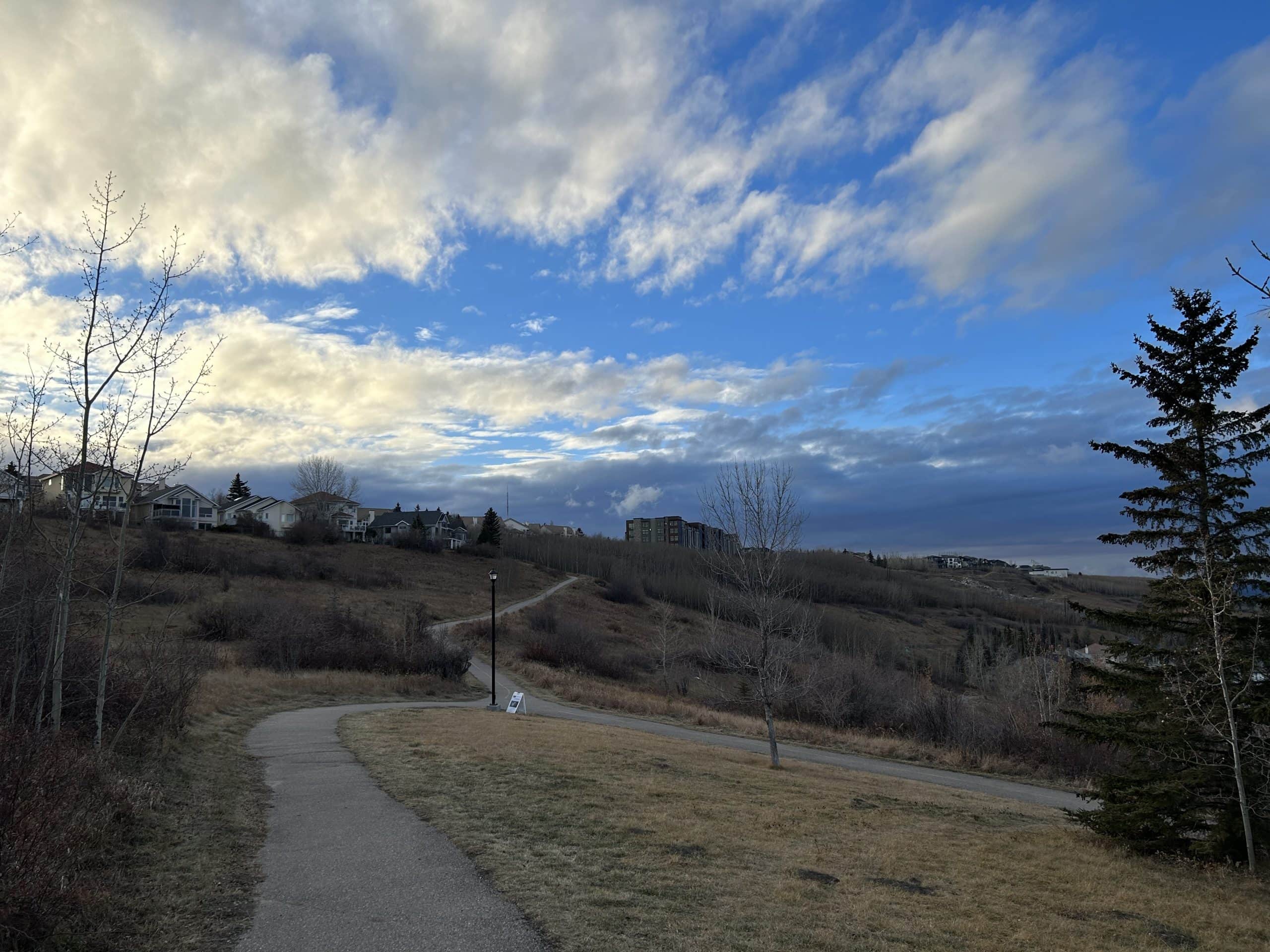 Patterson homes overlooking the Bow River Valley, with hillside walking paths, mature green space and expansive views in west Calgary.