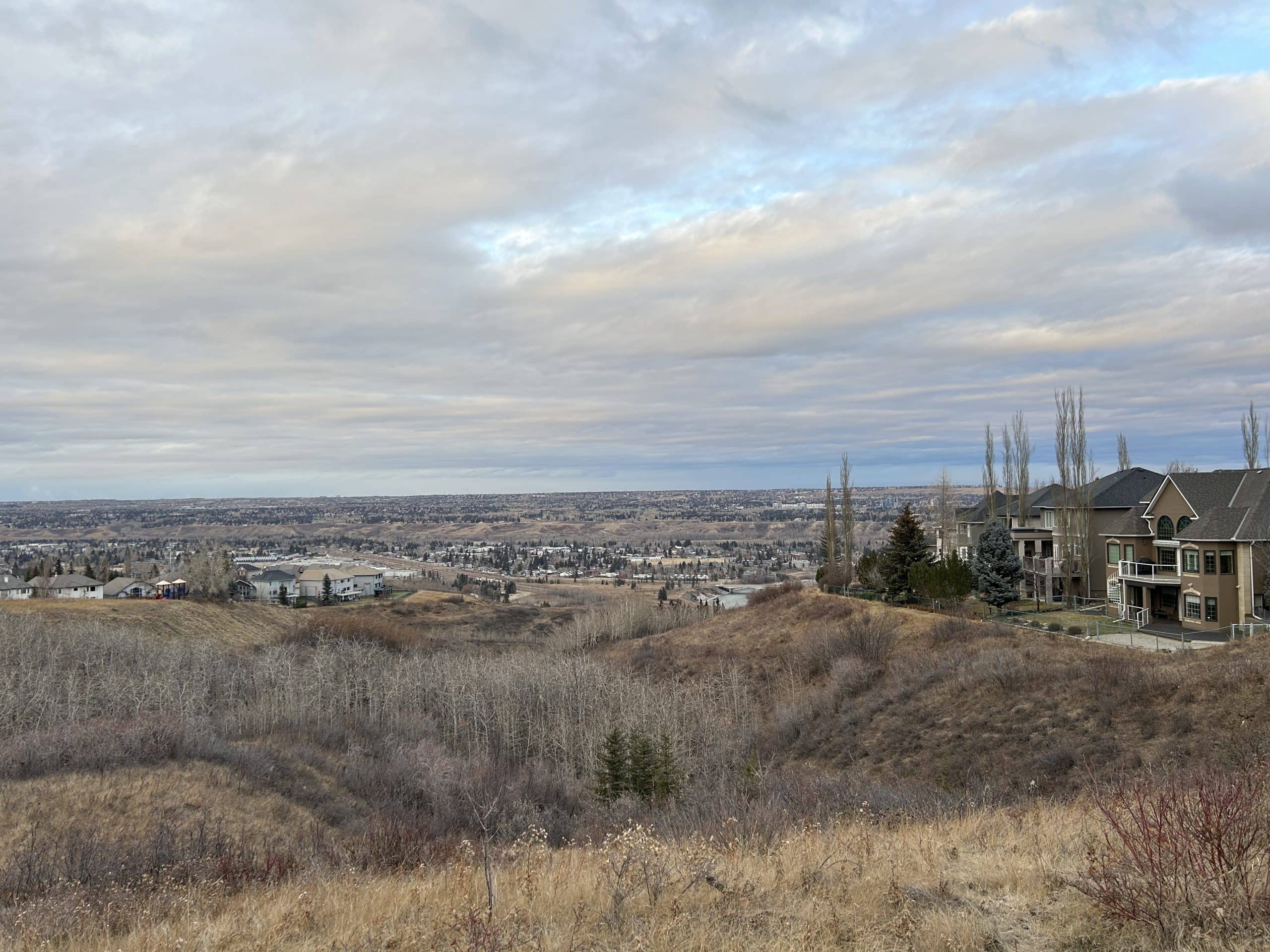 Patterson homes overlooking the Bow River Valley, with hillside walking paths, mature green space and expansive views in west Calgary.