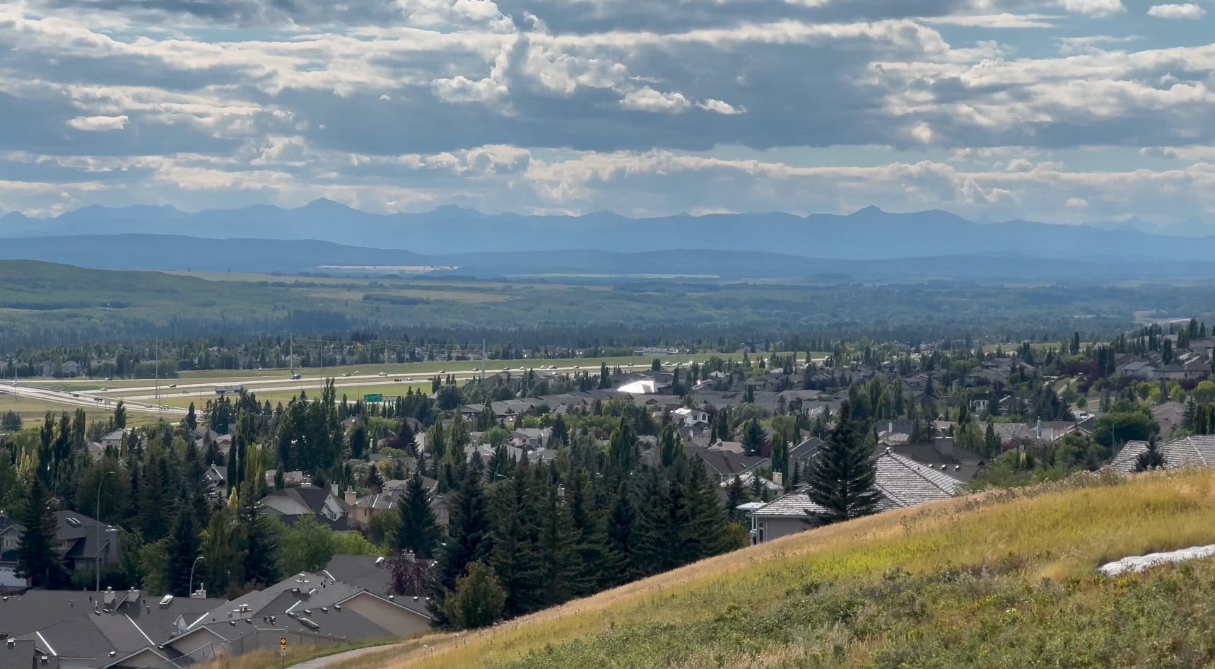 Signal Hill and Springbank Hill homes with sweeping views toward the Rocky Mountains in west Calgary, Alberta.