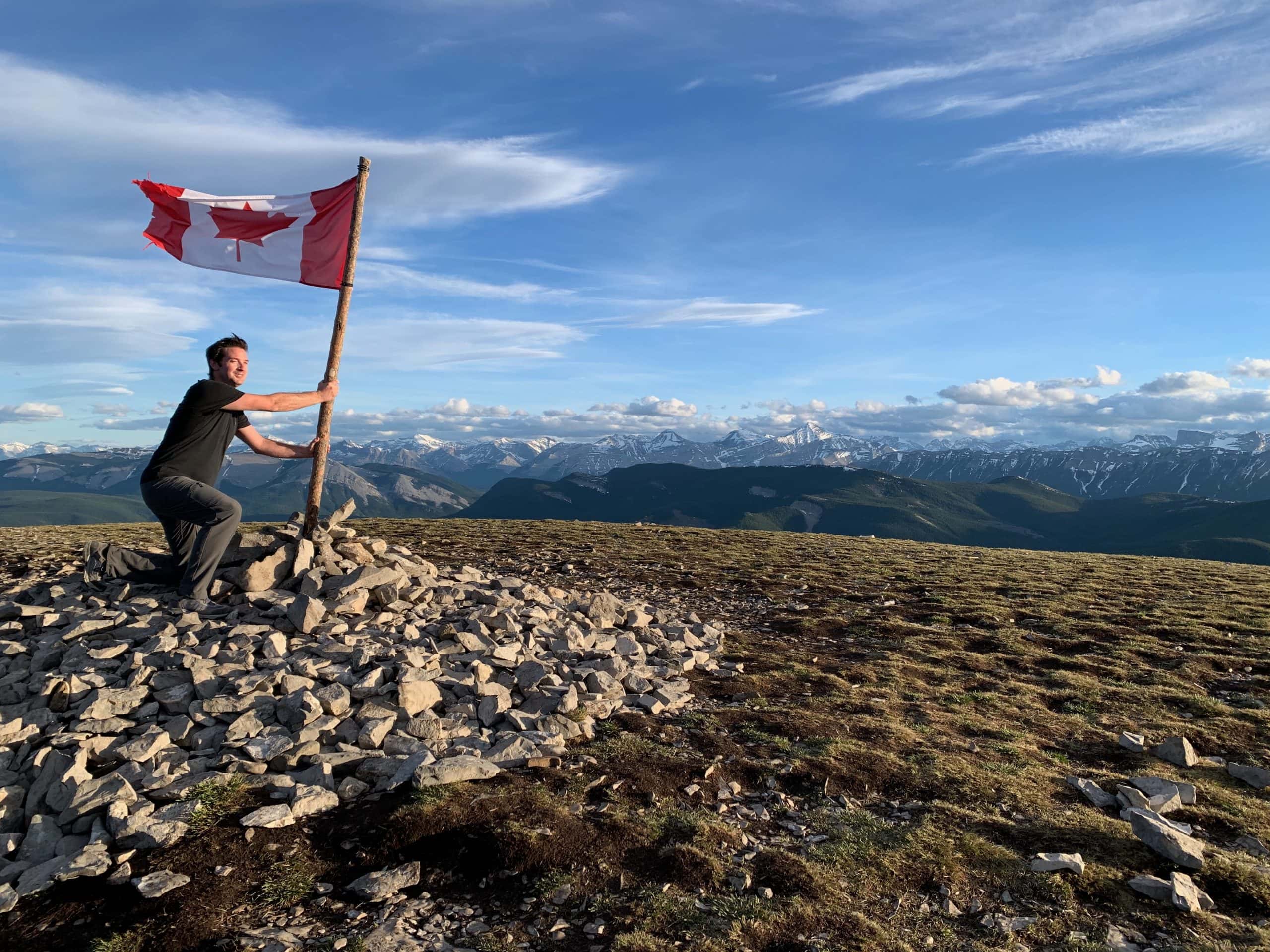 Prairie Mountain summit near Bragg Creek, Alberta, with panoramic views across Kananaskis and the Canadian Rockies.