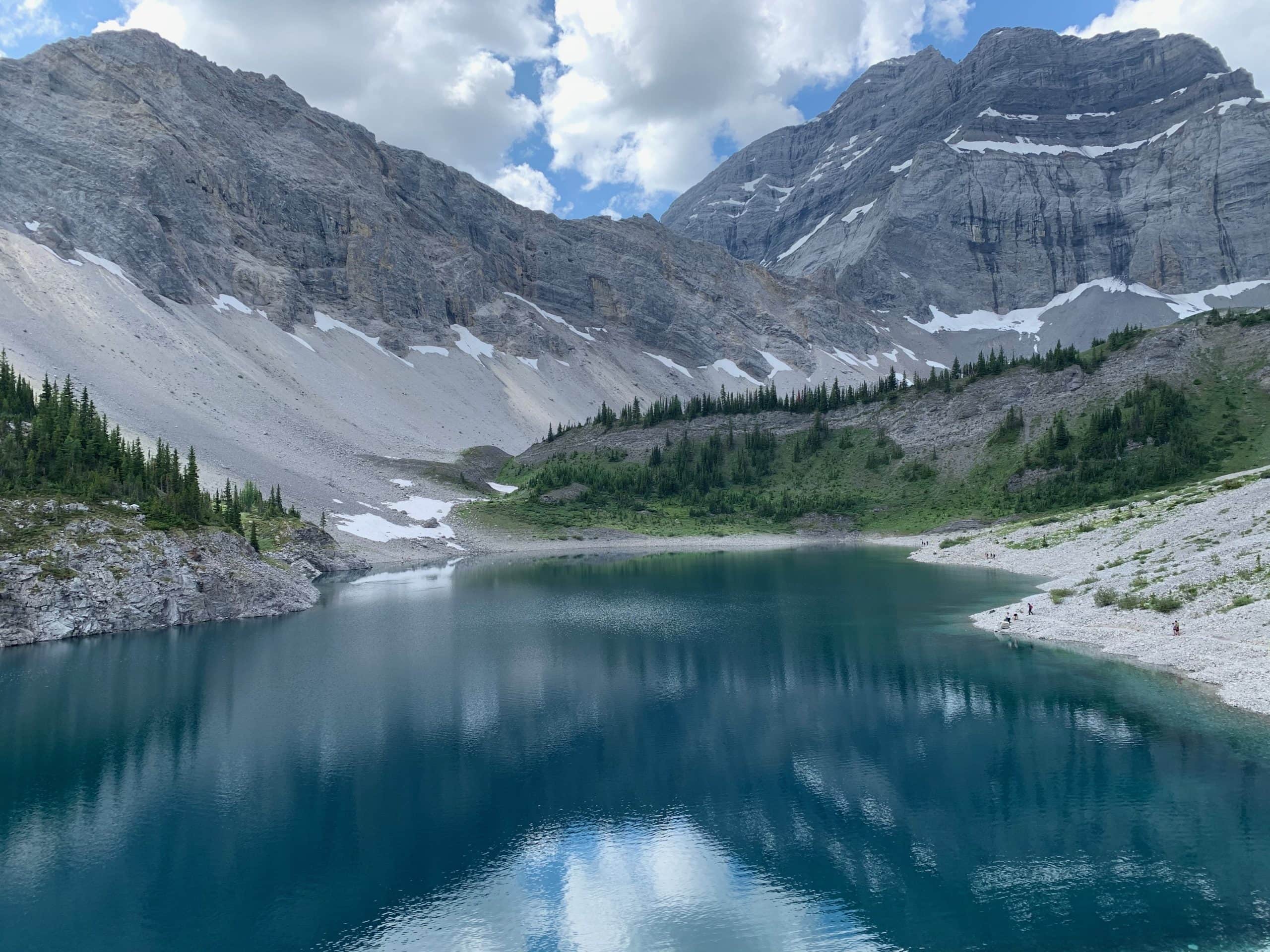 urquoise mountain lake surrounded by Rocky Mountain peaks in Kananaskis Country, Alberta.