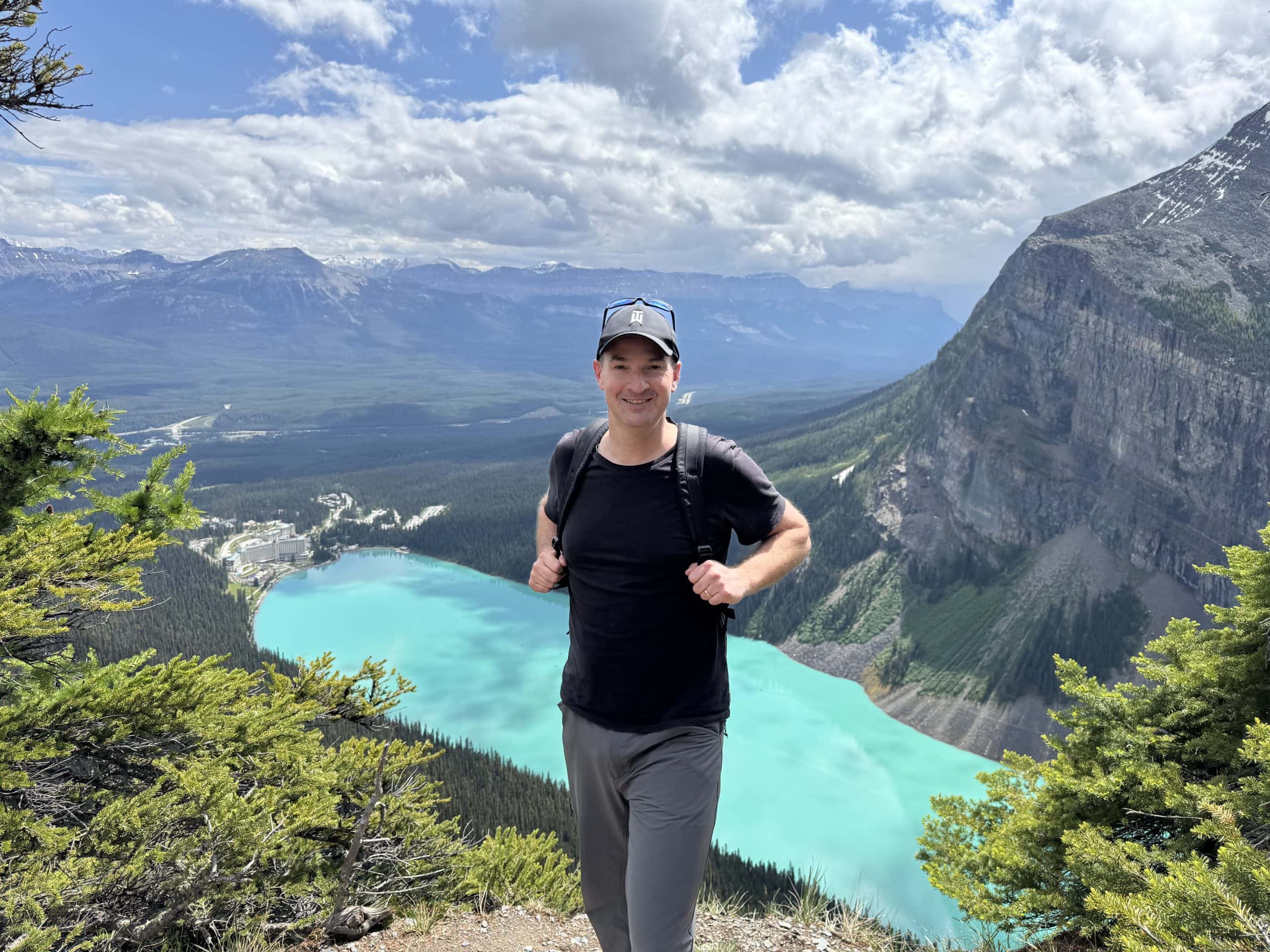 Hiking above Lake Louise with panoramic views of the turquoise lake and Canadian Rockies in Banff National Park, Alberta.