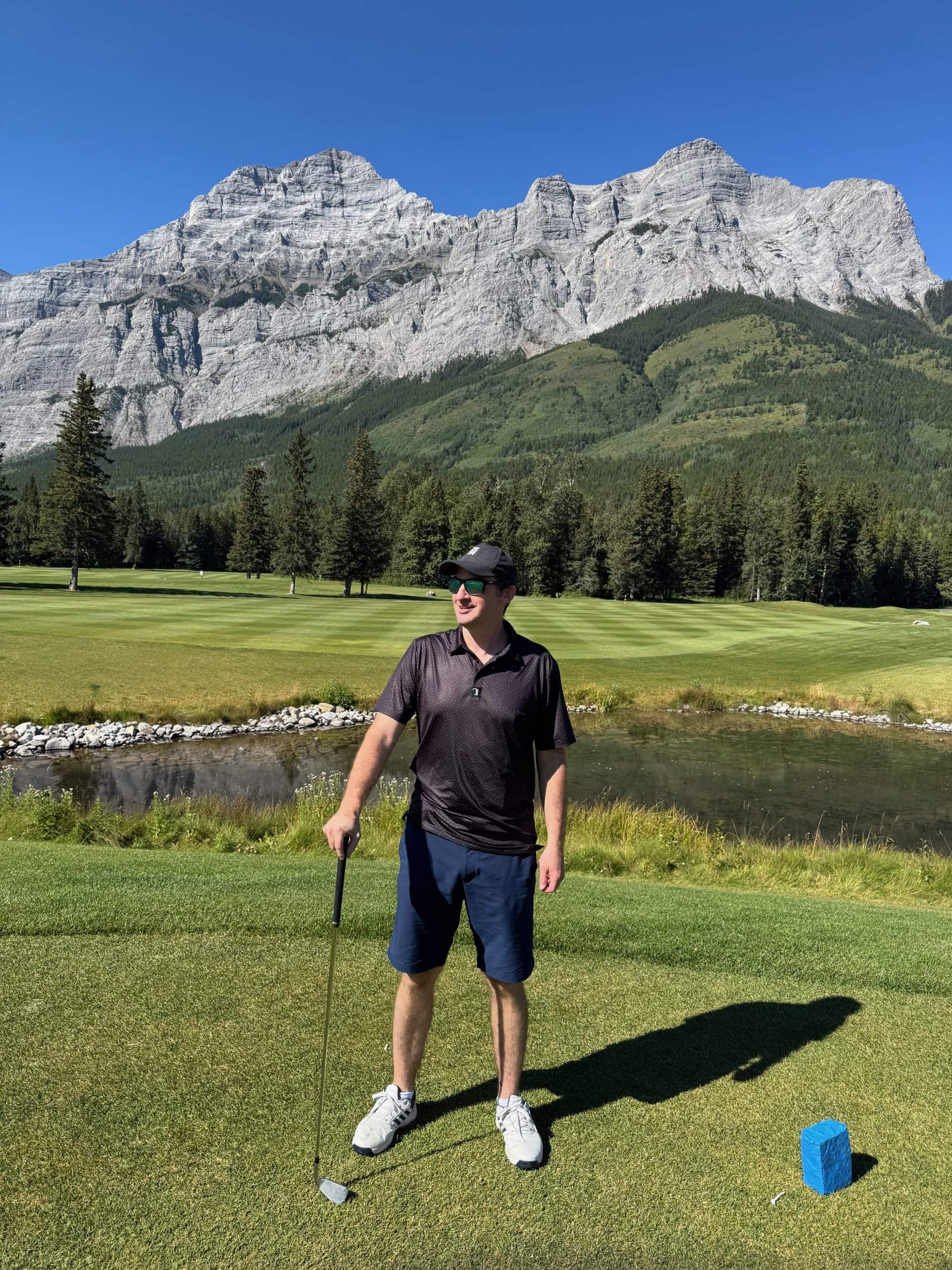Golfing at Kananaskis Country Golf Course surrounded by the Canadian Rockies.